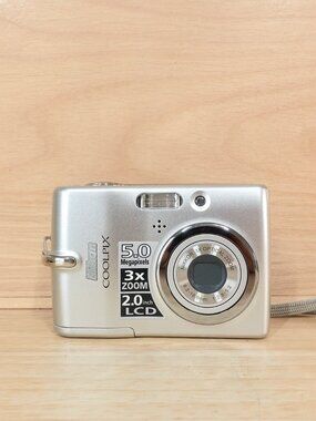 Share Nikon Coolpix L10 5MP CCD Digital Camera 3x Zoom Silver Tested Working